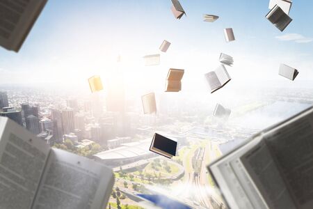 Books flying in the skyの写真素材