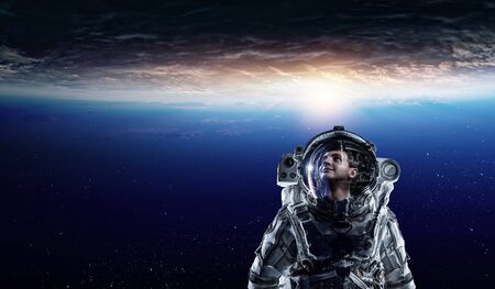 Astronaut in space on planet orbit.