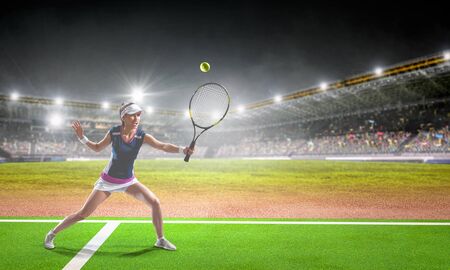 Young woman playing tennis in action. Mixed mediaの写真素材
