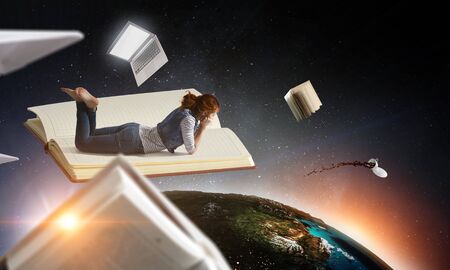 Little woman with large book conceptの写真素材