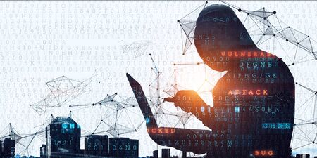 Hacker in hoodie dark themeの写真素材
