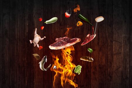Food Ingredients flying around fireの写真素材