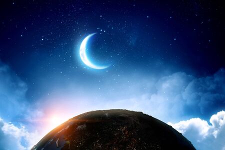 Earth, moon and stars on blue skyの写真素材