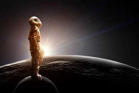 Spaceman and the planet Earth abstract themeの写真素材