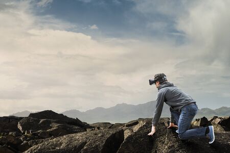 Young man in virtual reality. Mixed media