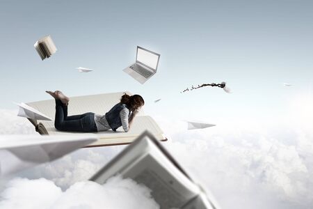 Little woman with large book conceptの写真素材