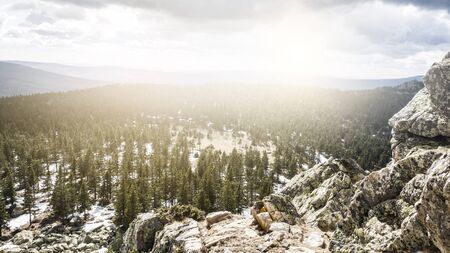 Mountain hills and forest landscape and cloudy skyの写真素材