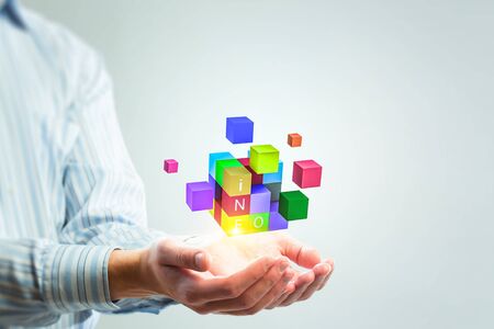Man`s hand and cubes levitating above. Mixed mediaの写真素材