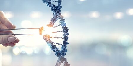 DNA molecules design with female hand holding pincers. Mixed mediaの写真素材