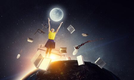 Cute happy little girl jumping. Mixed mediaの写真素材