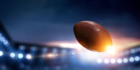 Night football arena in lights with a ball close upの写真素材