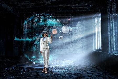 Young female in virtual reality. Mixed mediaの写真素材