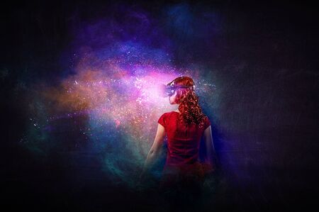Young female in virtual reality. Mixed mediaの写真素材