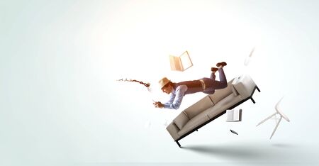 Smiling Joyful levitating young manの写真素材