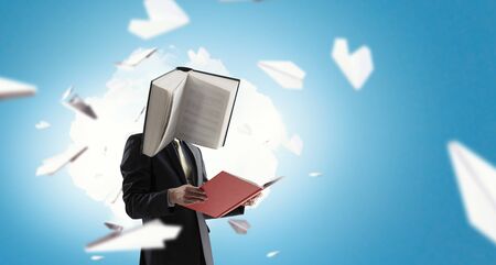 Businessman with book head. Business efficiency concept.の写真素材