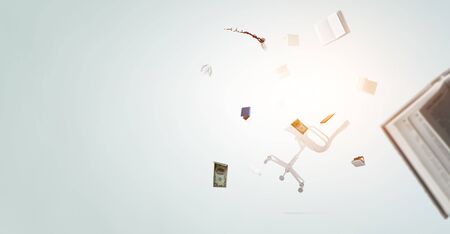 Flying office items isolated on whiteの写真素材