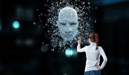 Silver digital head and a young woman in virtual reality headset. Mixed mediaの写真素材