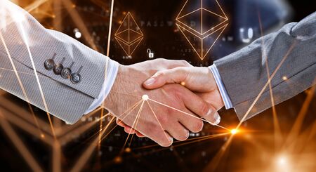 Business handshake by a man and a woman. Mixed mediaの写真素材