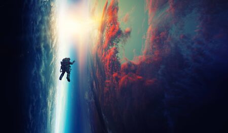Spaceman and planet, human in space conceptの写真素材