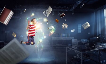 Cute happy little boy jumping. Mixed mediaの写真素材