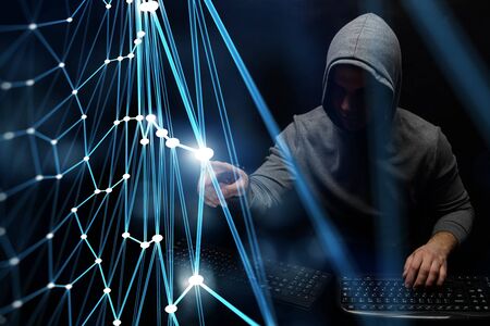 Hacker in hoodie dark themeの写真素材