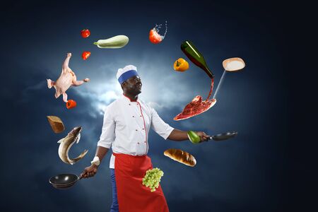 Black chef creative cooking. Mixed media.の写真素材