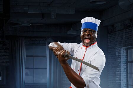 Black chef creative cooking. Mixed media.の写真素材