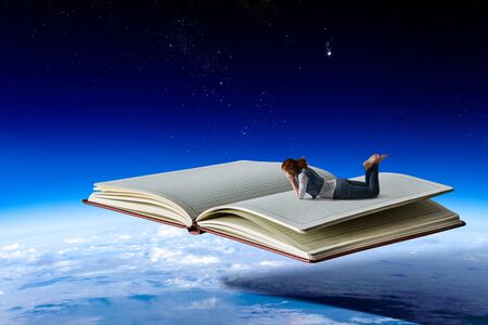 Little woman with large book conceptの写真素材