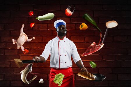 Black chef creative cooking. Mixed media.の写真素材