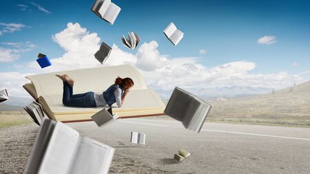 When reading takes you away. Mixed mediaの写真素材