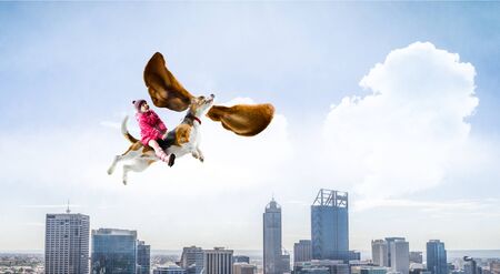 Super hero and her flying dogの写真素材