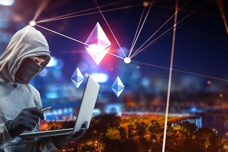 Hacker hunting for crypto currencyの写真素材
