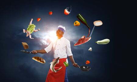 Black chef creative cooking. Mixed media.の写真素材
