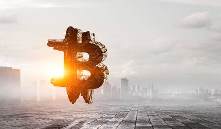 Bitcoin symbol on cityscape backgroundの写真素材