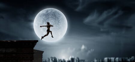 Jumping over precipice, challenge concept.の写真素材