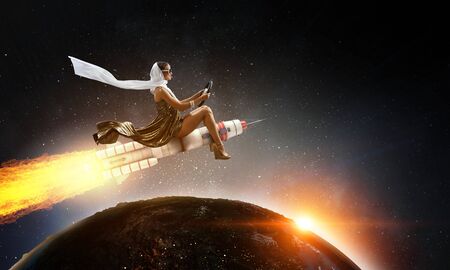 Woman on space rocket . Mixed media