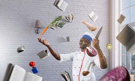 Black chef creative cooking. Mixed media.の写真素材