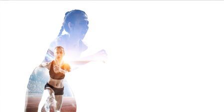 Abstract concept of running young sportswomanの写真素材
