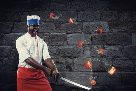 Black chef creative cooking. Mixed media.の写真素材