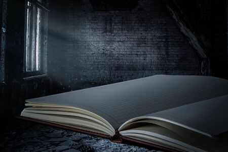 Notebook open on dark backgroundの写真素材