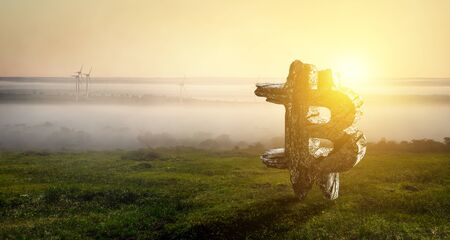 Bitcoin symbol on landscape backgroundの写真素材