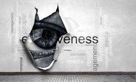 Eye peeping through hole. Mixed mediaの写真素材