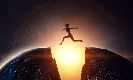 Woman runner overcoming difficulty. Mixed mediaの写真素材