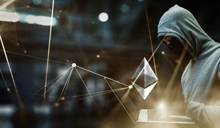 Hacker hunting for crypto currencyの写真素材