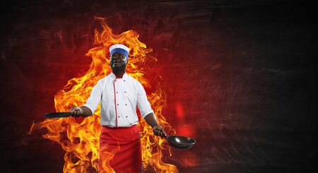 Black chef creative cooking. Mixed media.の写真素材