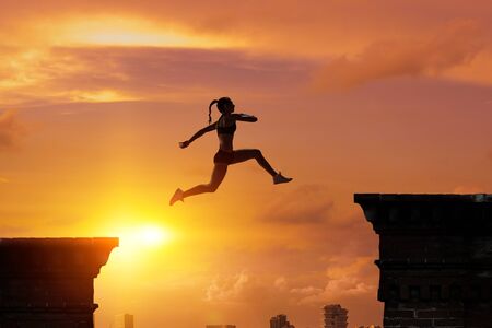 Jumping over precipice, challenge concept.の写真素材