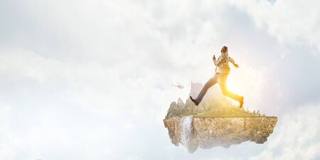 Black man in casual clothes in motionの写真素材