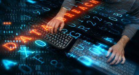 Hacker in hoodie dark themeの写真素材