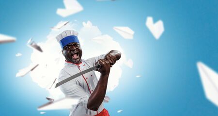 Black chef creative cooking. Mixed media.の写真素材