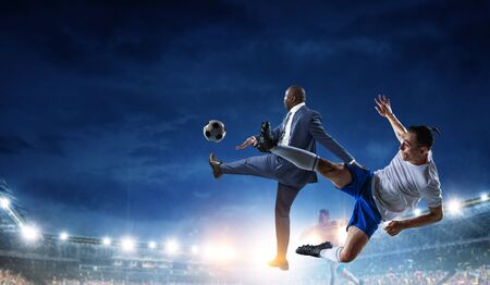 Soccer man in action with ball. Mixed mediaの写真素材